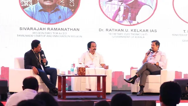 Speakers taking part in a technology event panel discussion