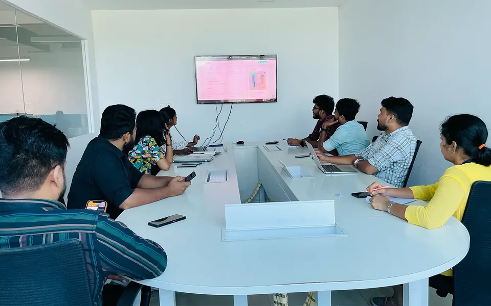 Trogon colleagues reviewing a project together in the meeting room